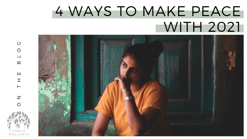 A graphic that reads "4 Ways to Make Peace With 2021" above a stock photo of a South Asian woman in front of a green door. She looks thoughtful.