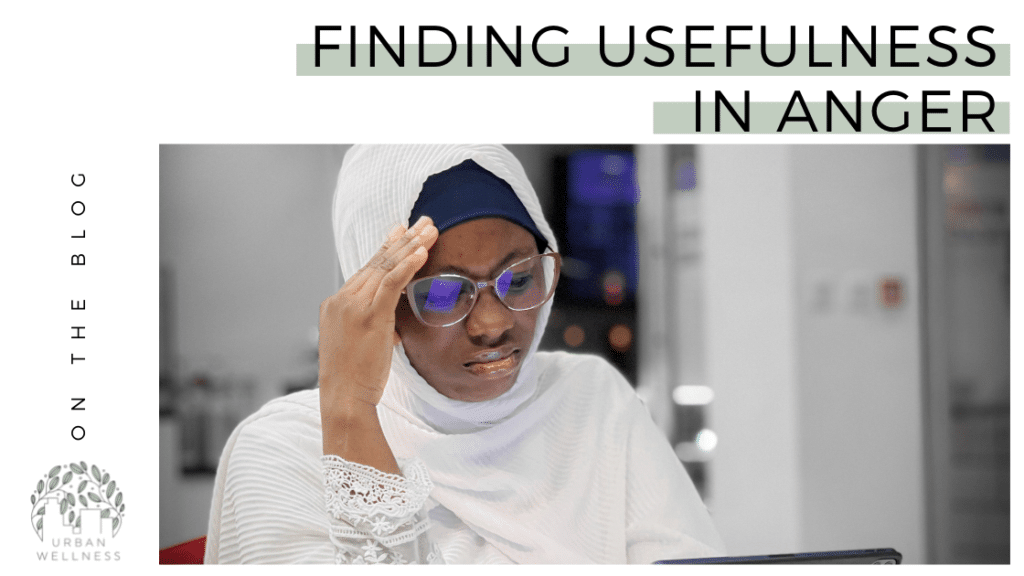 A graphic that reads "Finding Usefulness in Anger" in black text over a light green background, above a stock photo of a frustrated looking Black woman wearing a hijab; her hand is on her forehead and is frowning.