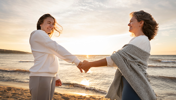 Side View Smiley Women Holding Hands1.png